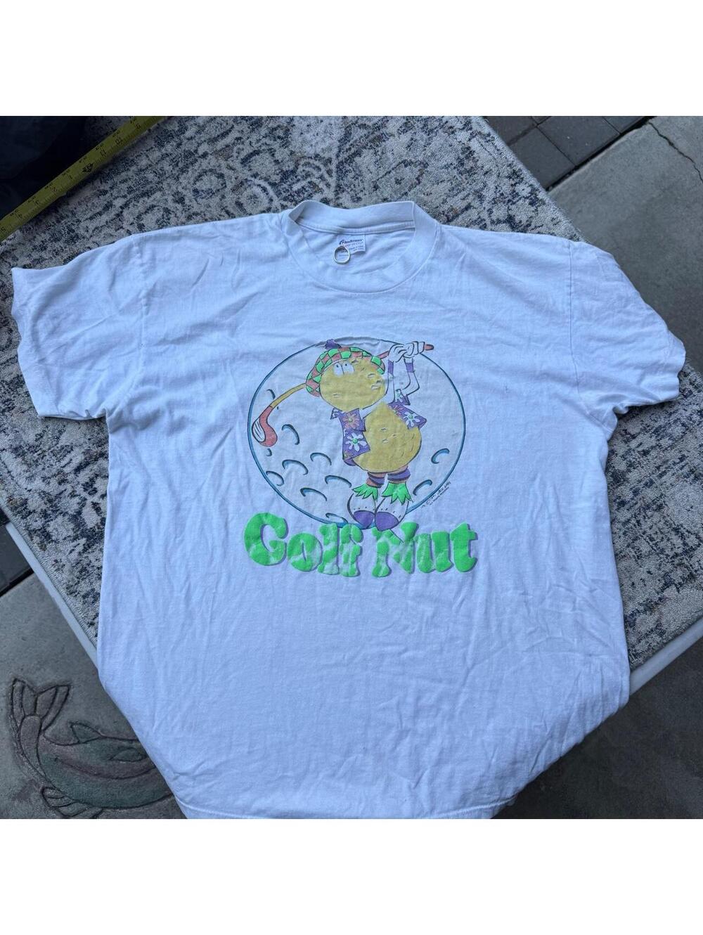 Vintage golf shirt thrashed with holes and stains